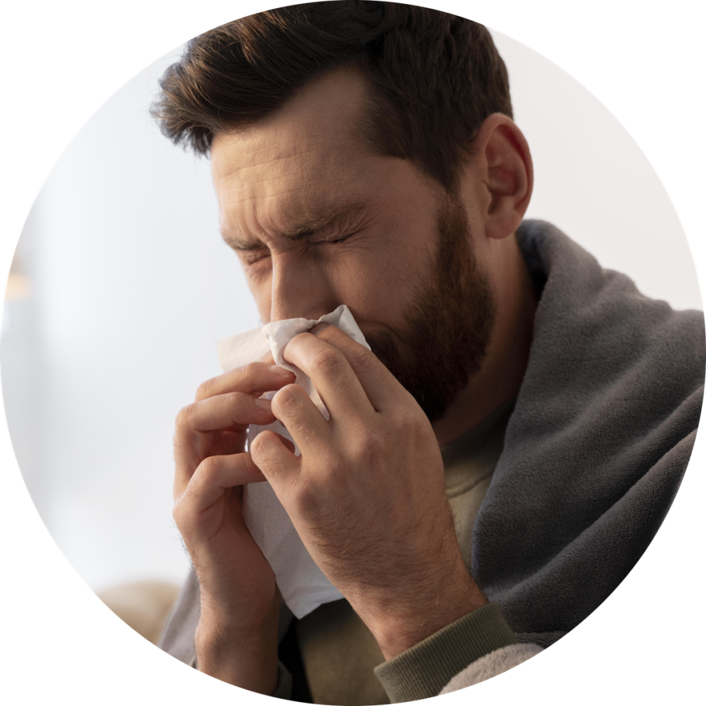 Sick man blowing his nose, eligible for sick leave certificate from work