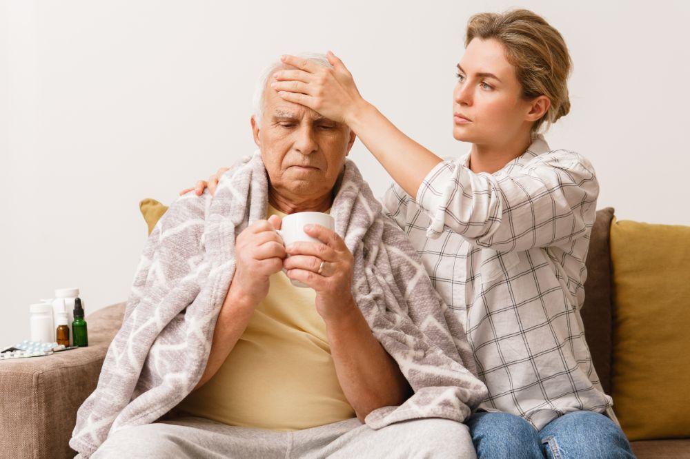 Woman taking care of her grandfather who needs carer's leave